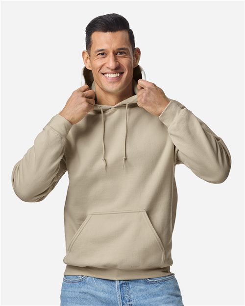 Model wearing a sand-colored fleece hooded sweatshirt, a popular blank for embroidered wedding keepsakes